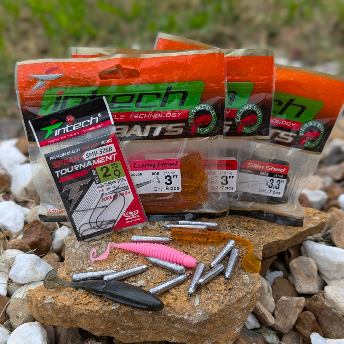 Finesse fishing tackle with Intech soft plastics, Tournament Spear hooks, and cylindrical drop-shot weights on rocks.