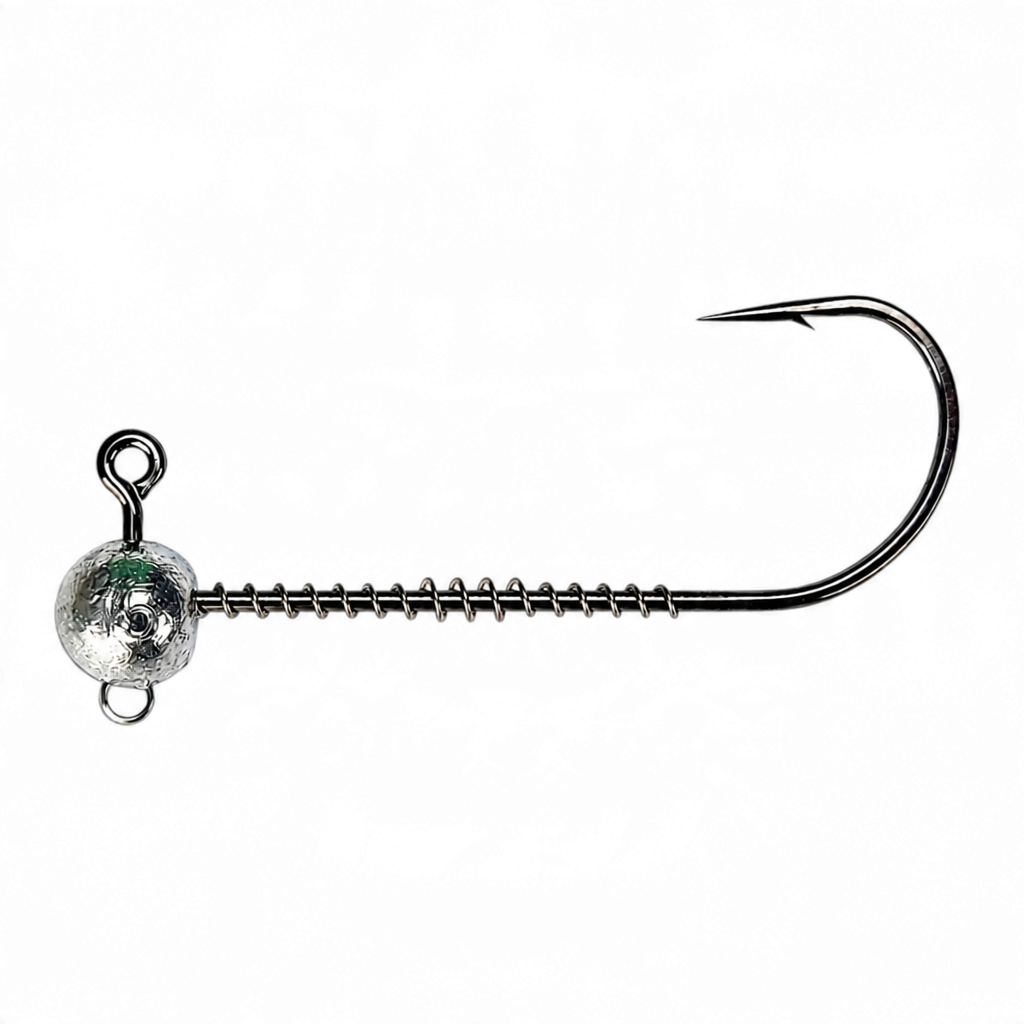 FishTrailCo screw lock jig head with a coil spring keeper, upper line-tie eye and lower stinger eye, shown horizontally.