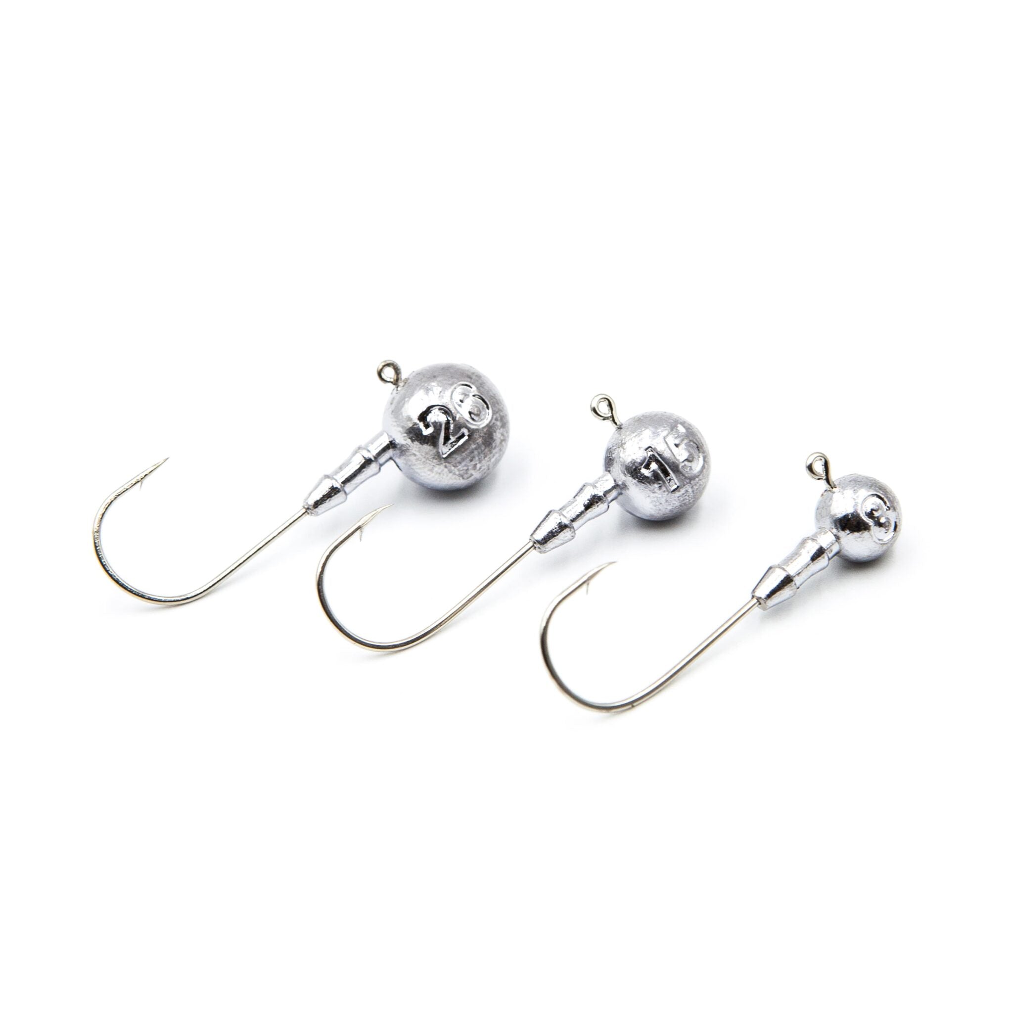 Three unpainted classic round ball jig heads with Gamakatsu 4/0 hooks.