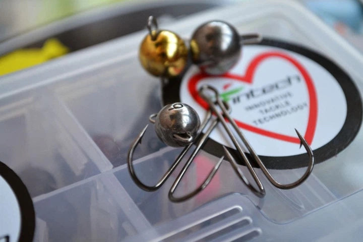 Fishing hooks with a heart-shaped label on a clear container