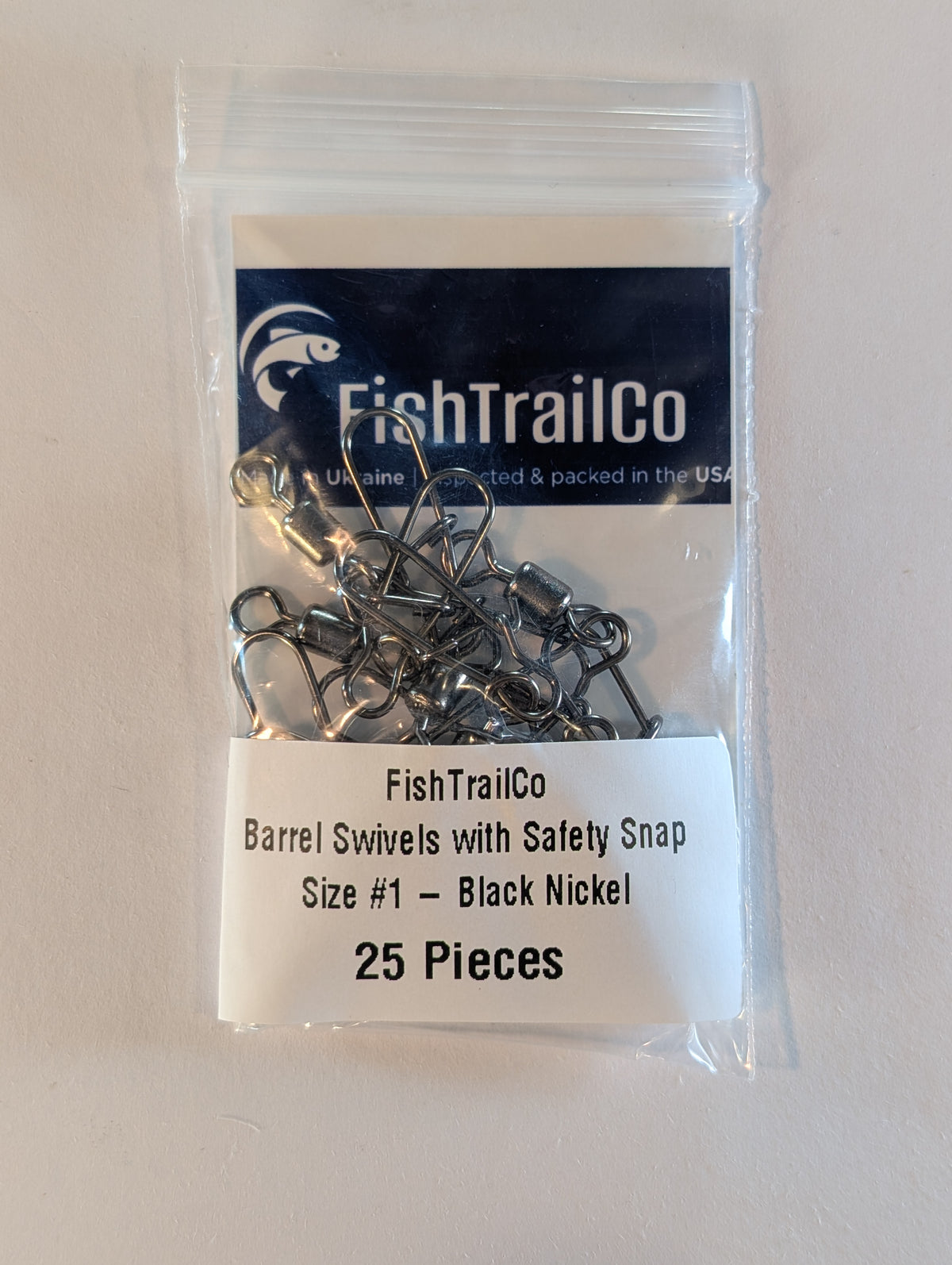 FishTrailCo size #1 black nickel barrel swivels with safety snaps, 25-piece package.