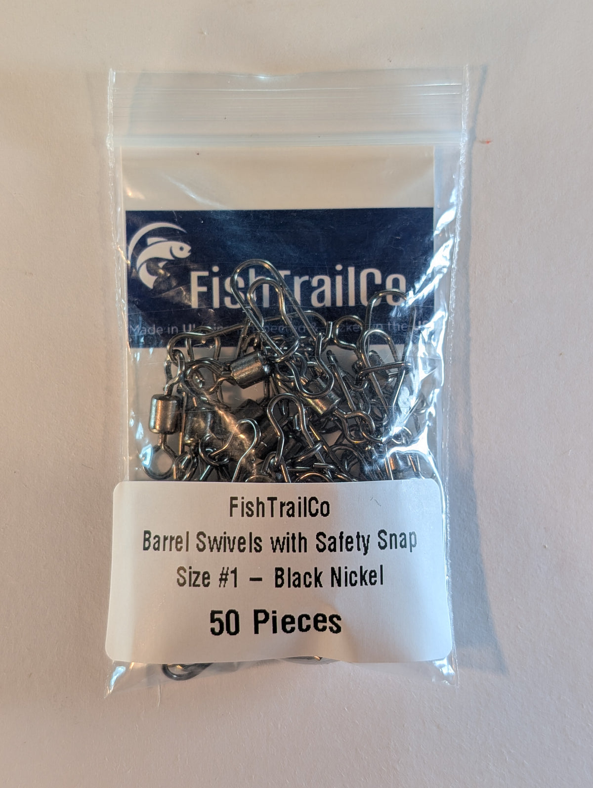 FishTrailCo size #1 black nickel barrel swivels with safety snaps, 50-piece package.