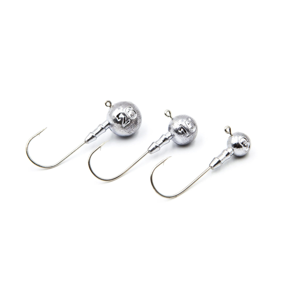 Three unpainted FishTrailCo Classic Round Jig Heads with G-Series hooks.