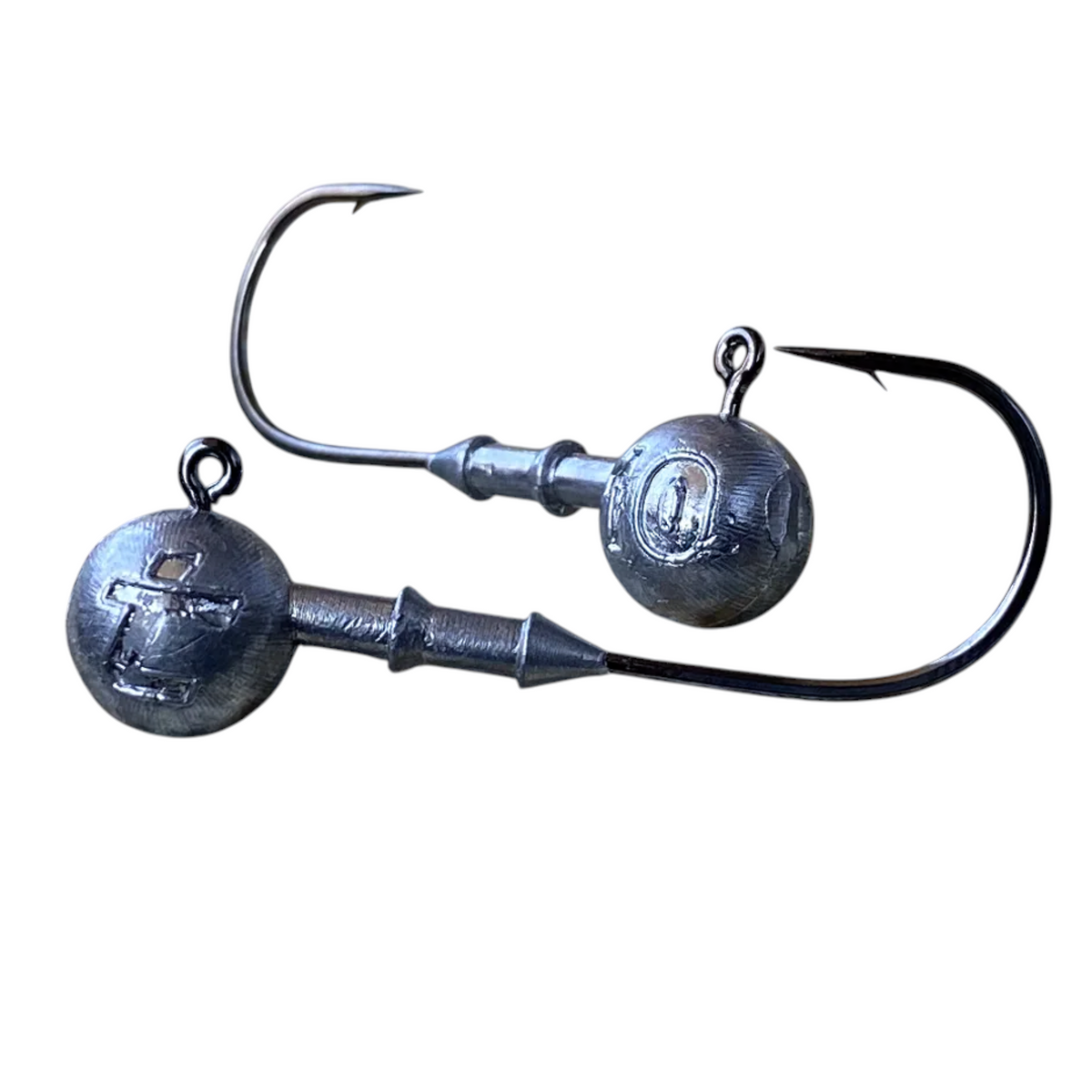 Two Intech Big Game Puncher round jig heads with wide-gap hooks and double-collar bait keepers on a white background.